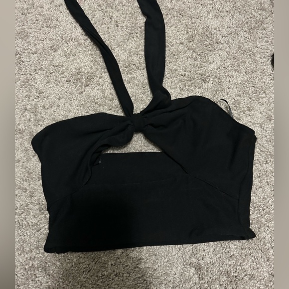 Size small, black crop top with a tie around neck. - Picture 1 of 2